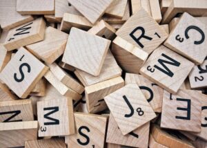 Scrabble word blocks randomly piled up